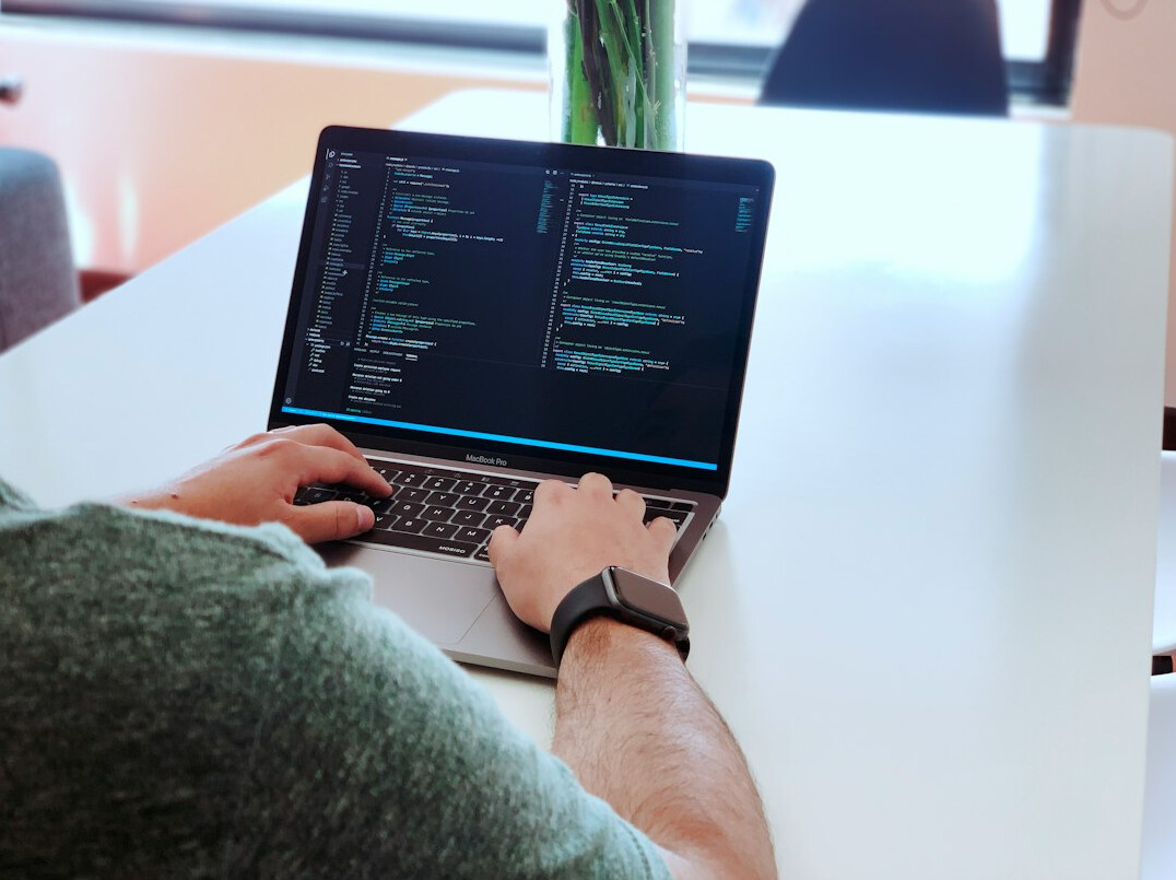 programmer coding at desk